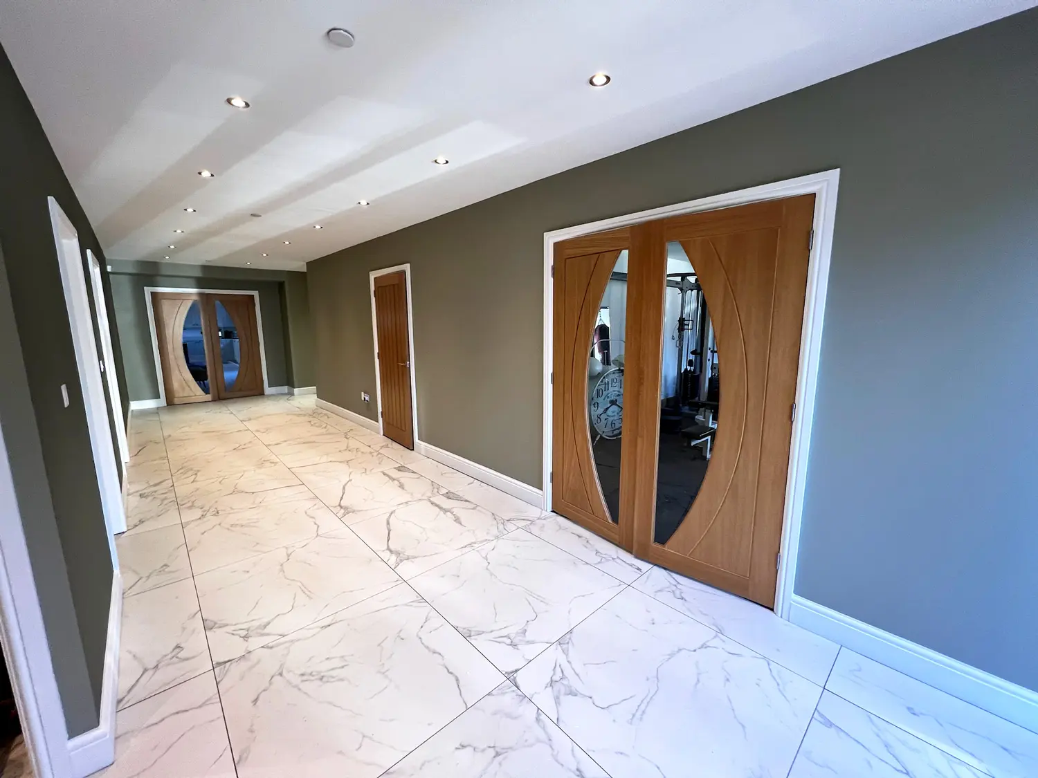 A newly decorated allway with green painted walls